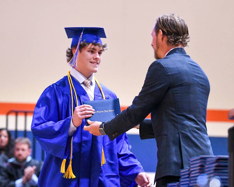 Genoa-Kingston senior John Krueger receives his diploma during his graduation ceremony Saturday, May 18, 2024, at Genoa-Kingston High School, 980 Park Ave., Genoa.