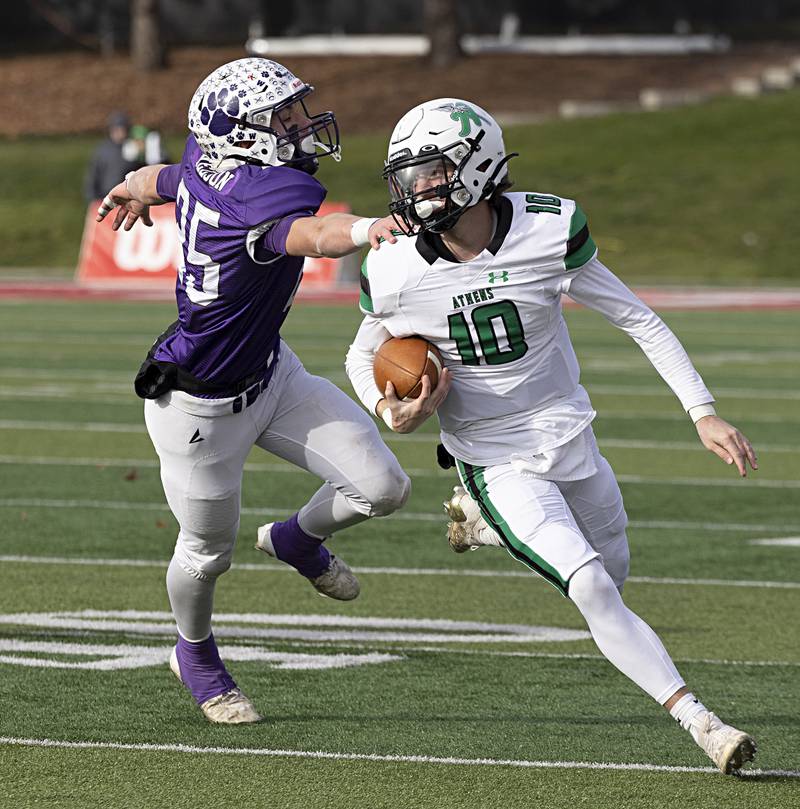 Athens’ Drew Cushman gets away from Wilmington's Ryan Nelson Friday, Nov. 24, 2023 in the 2A state football championship game at Hancock Stadium in Normal.