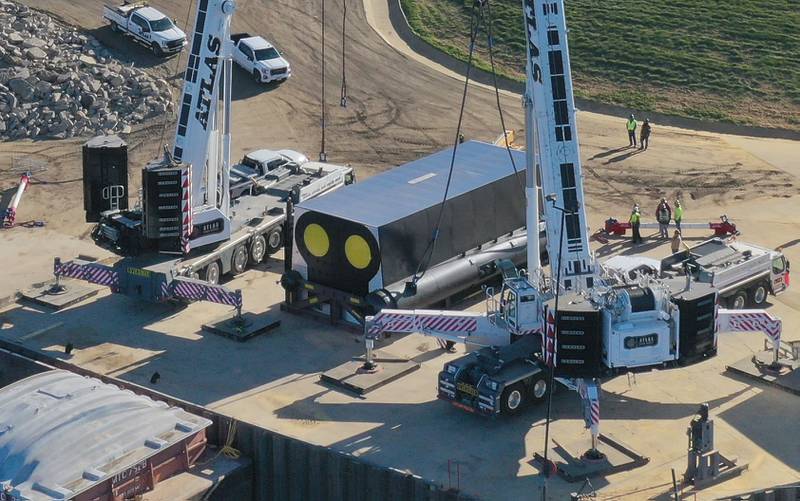 A crew from Atlas Crane Services hoist a 300,000 pound boiler made by the Cleaver-Brooks company in Lincoln Neb. on Wednesday Dec. 13, 2023 at Marquis Energy in Hennepin.. The boiler was transported by barge to to Hennepin from Nebraska using the Missouri River, Mississippi River and Illinois River. Marquis Energy is expected to receive several boilers within the next 12 months.