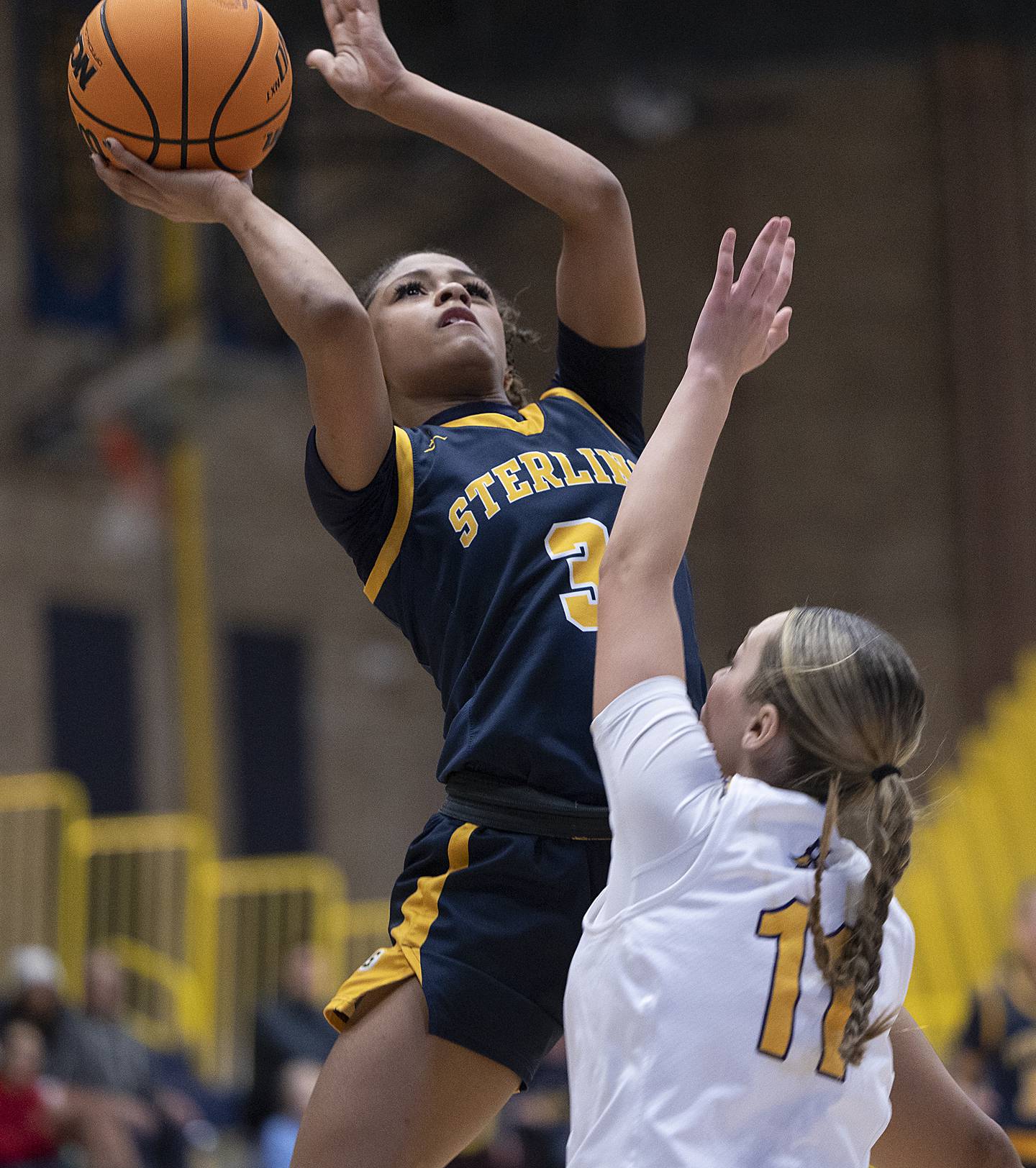 Sterling’s Delali Amankwa puts up a shot against Hononegah’s Reese Gunderson Saturday, Dec. 21, 2024, during the Sterling Shootout.