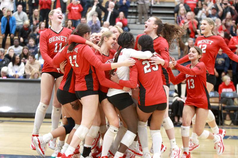 Benet players celebrate their Class 4A St. Charles North Supersectional win on Monday, Nov. 11, 2024 against New Trier.