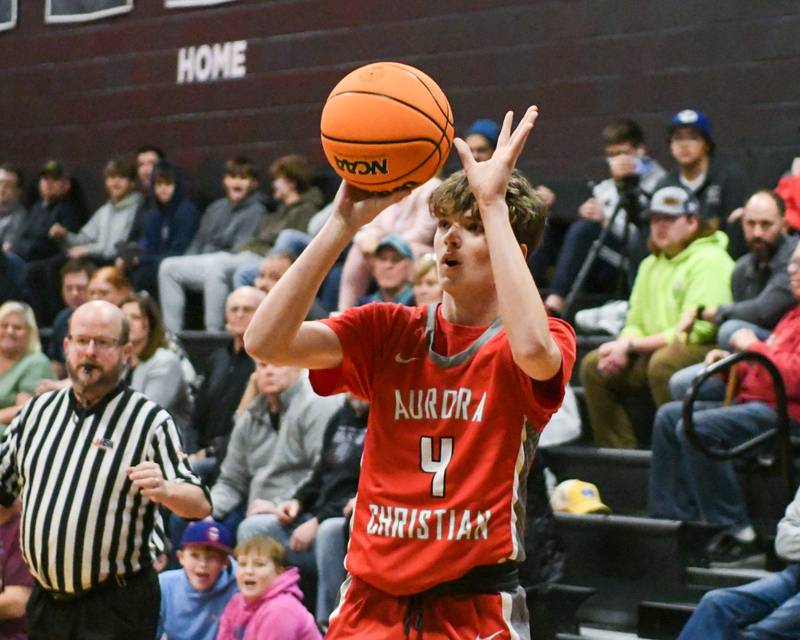 Aurora Christian's Joe DeCort (4) make a three-point basket during the game on Friday Feb. 28, 2025, while taking on Yorkville Christian during the regional title game held at Indian Creek High School.