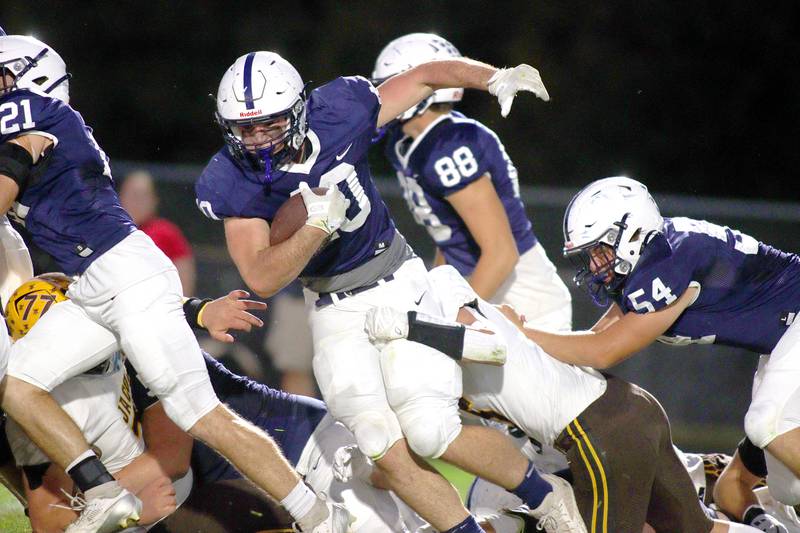 Cary-Grove’s Logan Abrams runs the ball against Jacobs in varsity football on Friday, Sept. 20, 2024, at Al Bohrer Field on the campus of Cary-Grove High School in Cary.