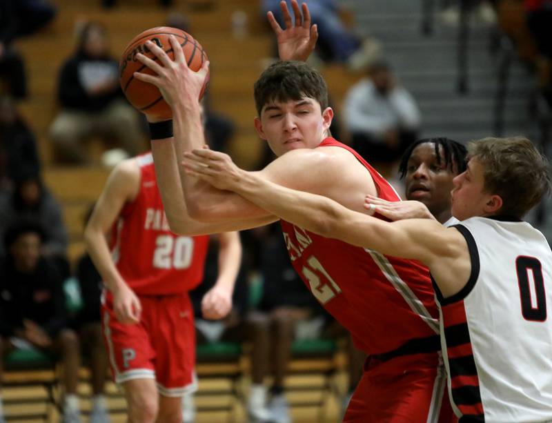 Palatine’s Connor May holds onto the ball under pressure from Bolingbrook during the Jack Tosh Holiday Classic semifinals at York High School in Elmhurst on Friday, Dec. 29, 2023.