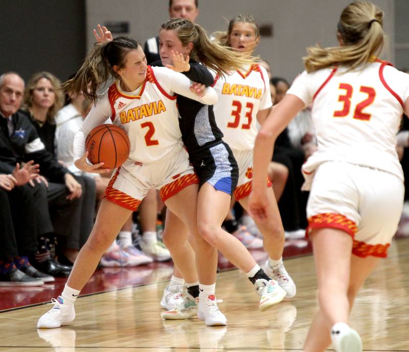 Batavia’s Brooke Carlson struggles with the St. Charles North defense during a game against St. Charles North at Batavia on Thursday, Jan. 12, 2023.