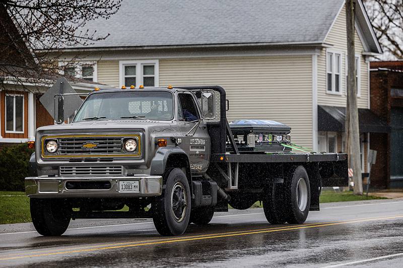 A truck driven by Jeff Bielema carries Jayden Hanson's casket to his final resting place Thursday, April 4, 2024, in Prophetstown. Hundreds turned out with vehicles of all kinds in recognition of Hanson who, with two other friends, died in a traffic crash near Tampico.