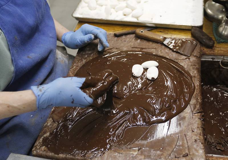 Debbie Bartmann makes Easter eggs on Thursday, March 27, 2025, at Anderson's Candy Shop in Richmond.