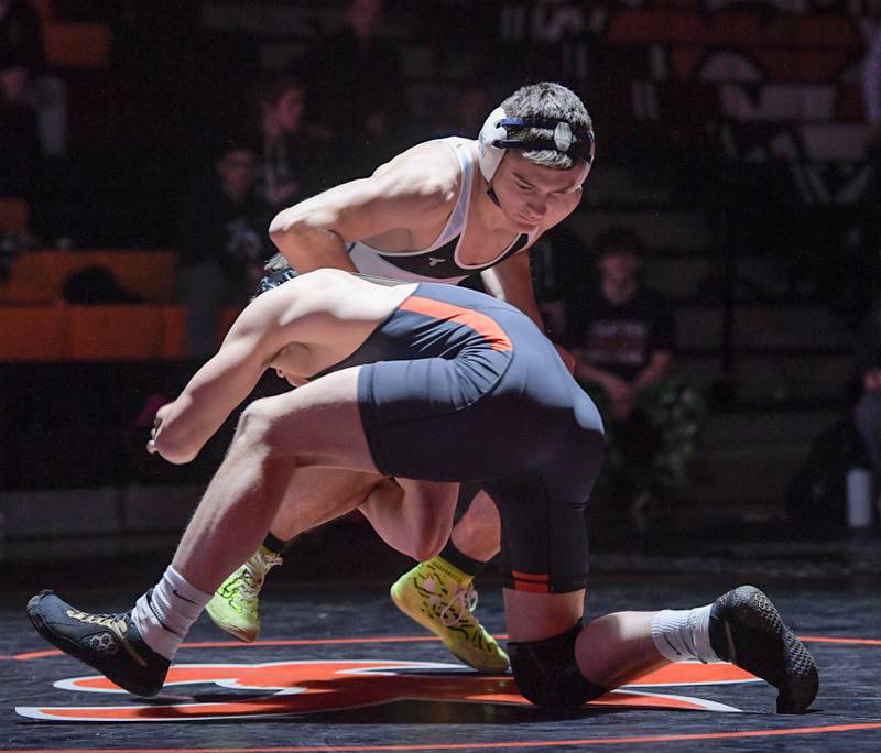 Marian Central's Nic Astacio and St. Charles East's Brody Murray wrestle at 175 pounds during a match in St. Charles on Wednesday, December 20, 2023.