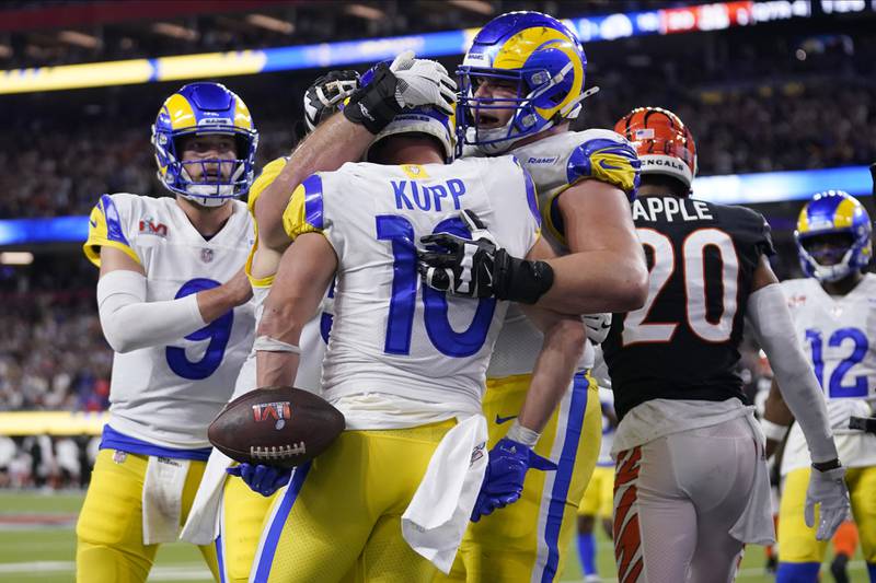 Los Angeles Rams wide receiver Cooper Kupp (10) is congratulated by teammates after scoring a touchdown against the Cincinnati Bengals during the second half of the NFL Super Bowl 56 football game Sunday, Feb. 13, 2022, in Inglewood, Calif. (AP Photo/Marcio Jose Sanchez)