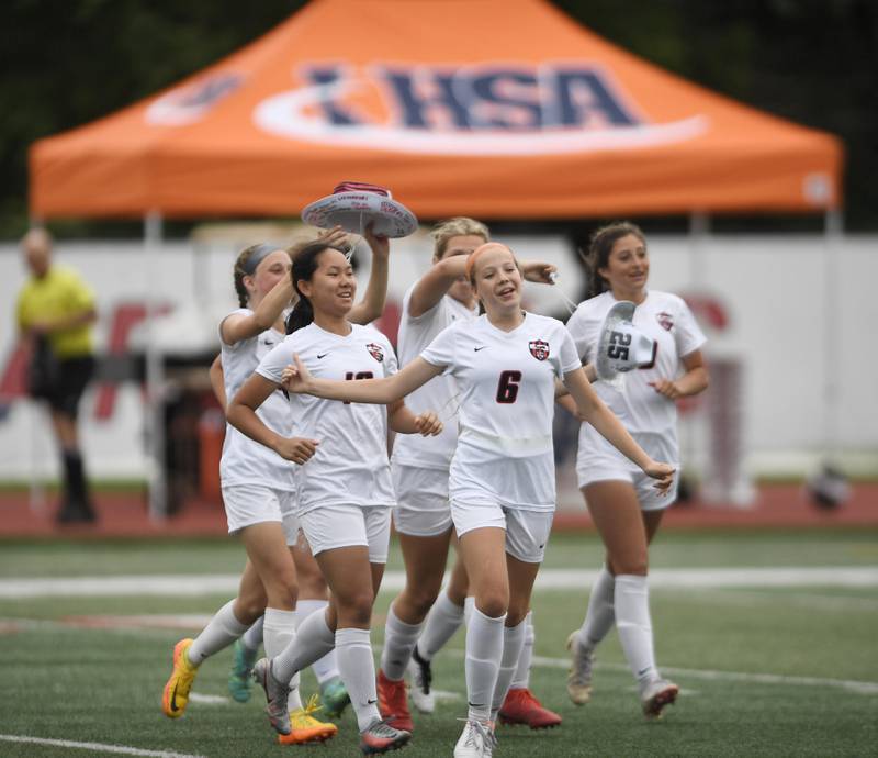 Lincoln-Way Central players celebrate their win against  Evanston in the Class 3A IHSA state girls soccer third-place game in Naperville on Saturday, June 4, 2022.