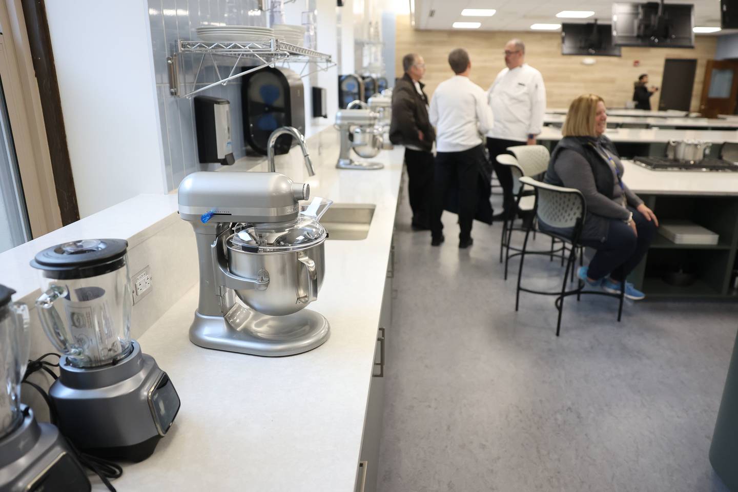 Guest tour one of the two state-of-the-art culinary labs that can accommodate 32 students at the ribbon cutting ceremony for Joliet Central’s new culinary arts addition on Monday, Jan. 6, 2025 in Joliet.