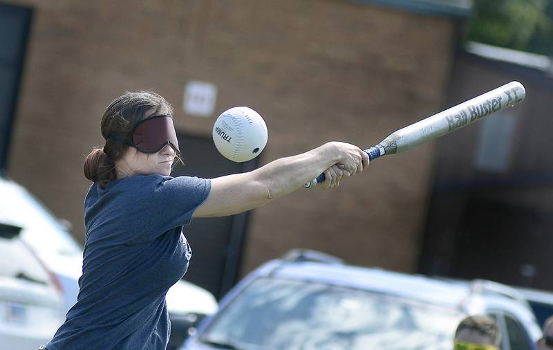 Samantha Davis of the Hardscrabble Lions Club team finds it hard to hit a beeping baseball Saturday, Aug. 19, 2023, as she takes a swing and misses during a game against the Chicago Comets at Northlawn School in Streator.