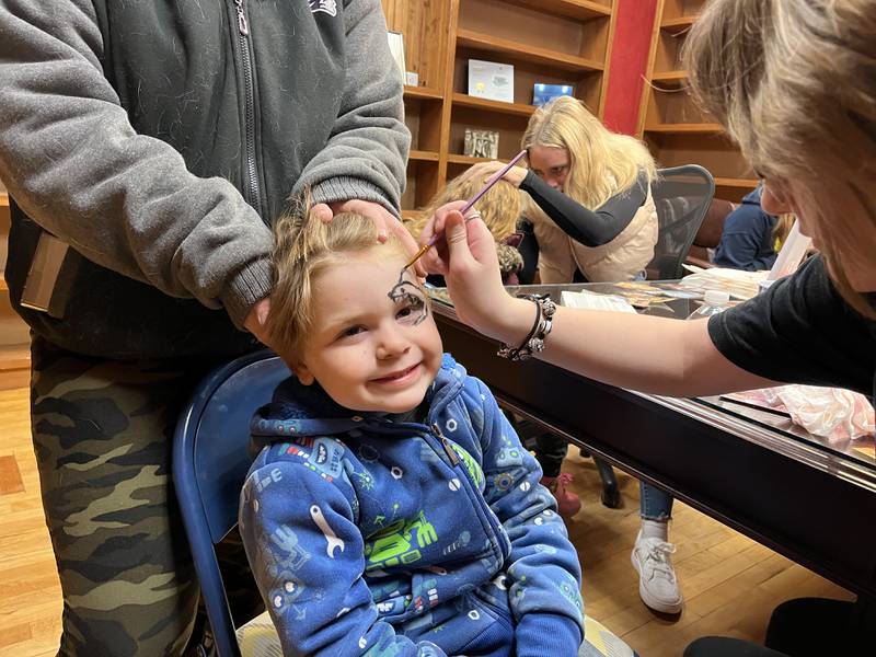 Tyler Steele, 4, of Polo gets his face painted at Northwestern Mutual in Polo on Saturday, Dec. 7, 2024. Face painting was just one of many activities offered during the annual Polo Christmas Festival.