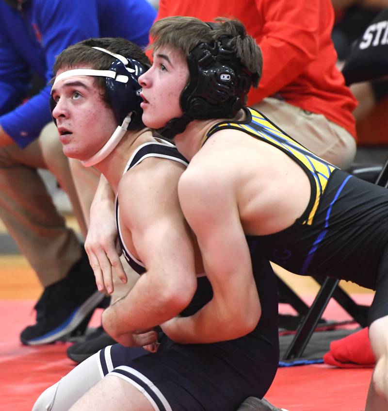 Johnsburg's Chase Davis and Lisle's Alexander Ferari look at the referee during their 132-pound match at the Stillman Valley Holiday Tournament on Saturday, Dec. 20, 2025 at Stillman Valley High School.