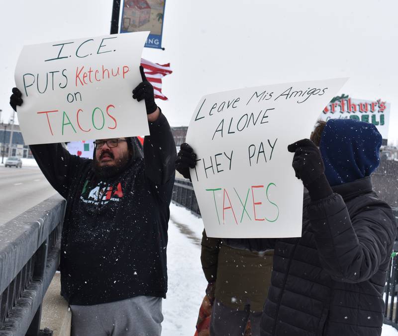 Dard Miniel and Oliver Band of Sterling peacefully demonstrate their thoughts on deportation on First Avenue bridge between Sterling and Rock Falls, Saturday, Feb. 15, 2025.