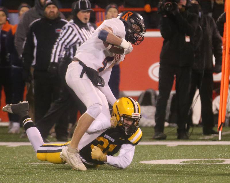 Rochester's Henry Buecker breaks free of a tackle by St. Laurence's Brendan Carroll during the Class 4A State football championship on Friday, Nov, 24, 2023 at Hancock Stadium in Normal.