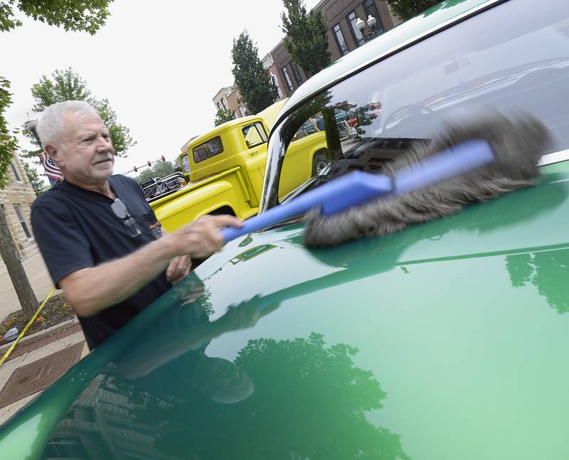 Jerry Judd brushes and shines up his 1955 Chevy 210 Friday night during the 27th annual Cruise Night in Ottawa. The event is put on by the La Salle County Cruisers.