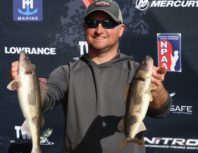 Mike Martin of Serena, holds up his fish during the annual Masters Walleye Circuit tournament on Friday, March 20, 2026 at the Spring Valley Boat Club.