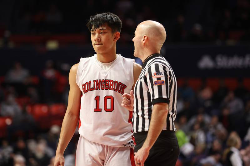 A referee talks with Bolingbrook’s MJ Langit during a break against Glenbard West in the Class 4A semifinal at State Farm Center in Champaign. Friday, Mar. 11, 2022, in Champaign.