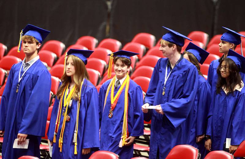 Geneva High School graduates enter the stadium for the 2024 commencement ceremony at Northern Illinois University in DeKalb on Tuesday, May 28, 2024.