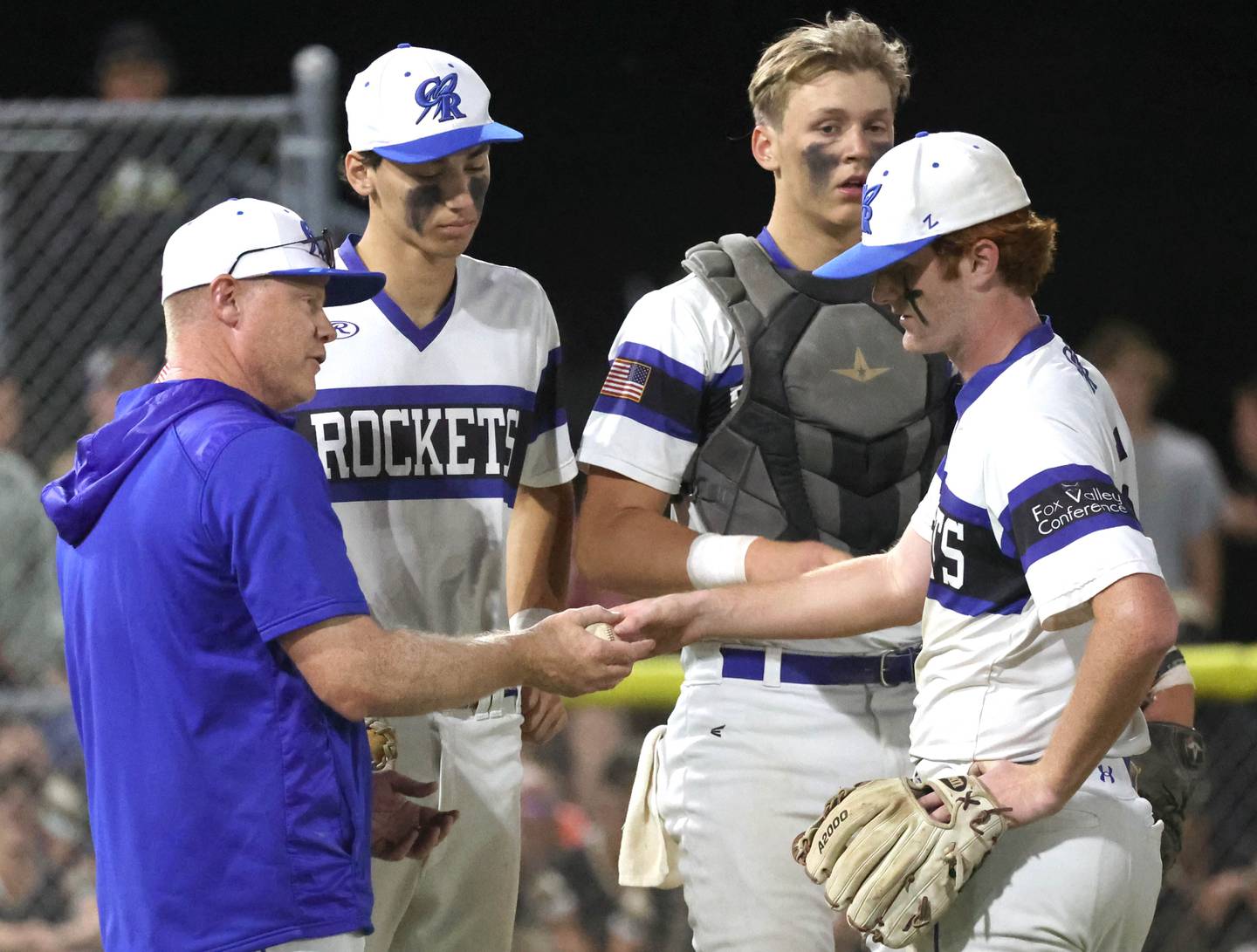 Burlington Central head coach Kyle Nelson takes the ball from pitcher Michael Person after he used up his pitch count during seven scoreless innings during the Class 3A sectional final game against Sycamore Friday, May 31, 2024, at the Sycamore Community Sports Complex.