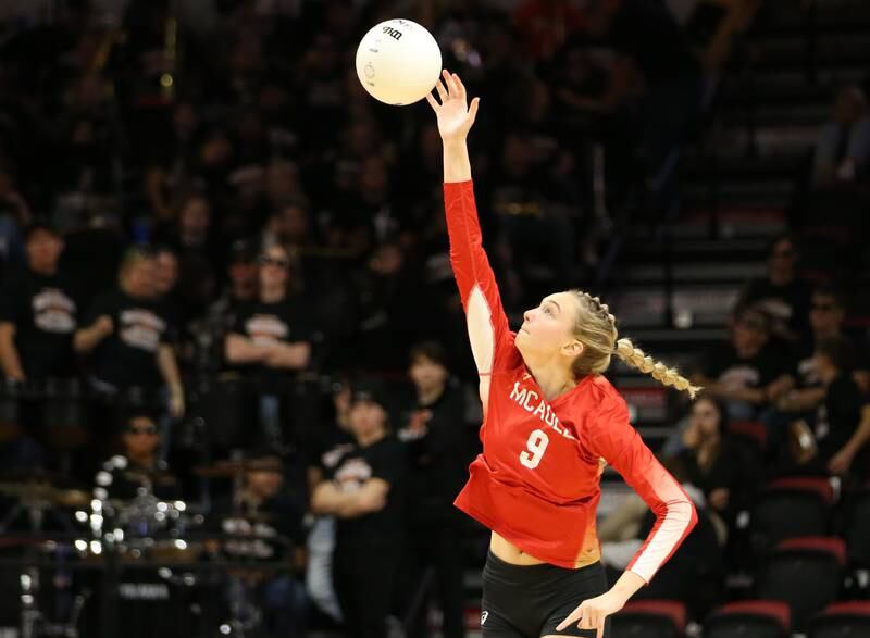 Mother McAuley's Ellery Rees serves the ball against St. Charles East in the Class 4A semifinal game on Friday, Nov. 11, 2022 at Redbird Arena in Normal.