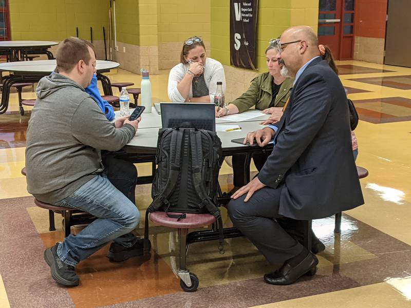 Dist. 308 Superintendent Andalib Khelghati, right, listens to community members during a facility planning workshop at Murphy Junior High School in Plainfield on Sept. 10, 2025.