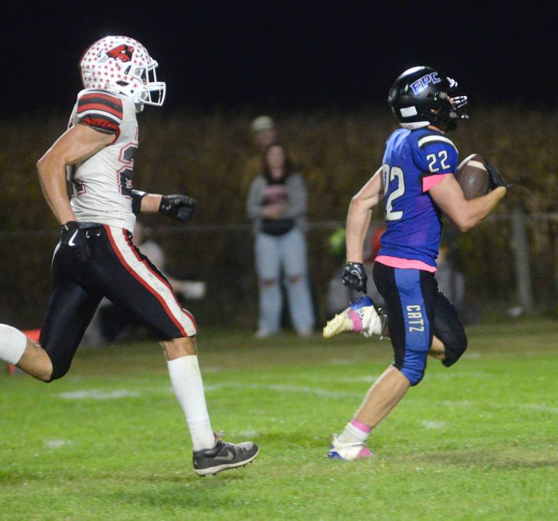 Eastland-Pearl City's Draven Zier (22) heads to the end zone during a Friday, Oct. 3, 2025 game against Forreston at Pearl City High School.
