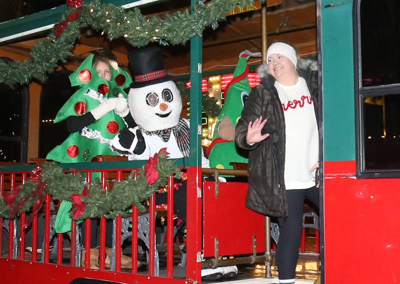 Jenica  Cole, executive director of the Princeton Area Chamber of Commerce, rides on a float during the "Night of Lights" parade on Friday, Dec. 5, 2025 downtown Princeton. The event featured the Christmas tree lighting at Veterans Park a lighted Christmas parade down Main Street,  Living Windows, a Candy Cane Hunt, and visits with Santa.