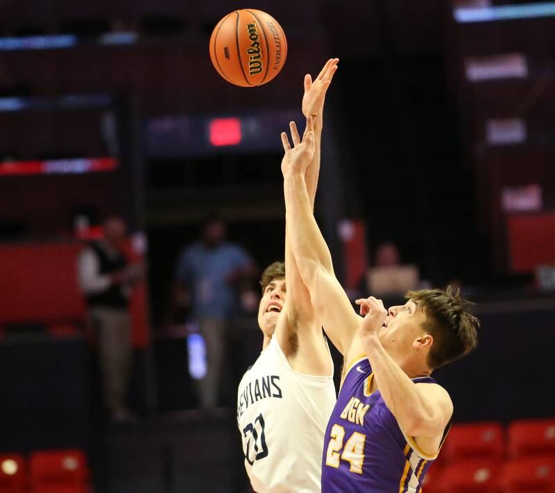 New Trier's Tyler Van Gorp wins a jump ball over Downers Grove North's George Wolkow during the opening tip of the Class 4A state third place game on Friday, March 10, 2023 at the State Farm Center in Champaign.