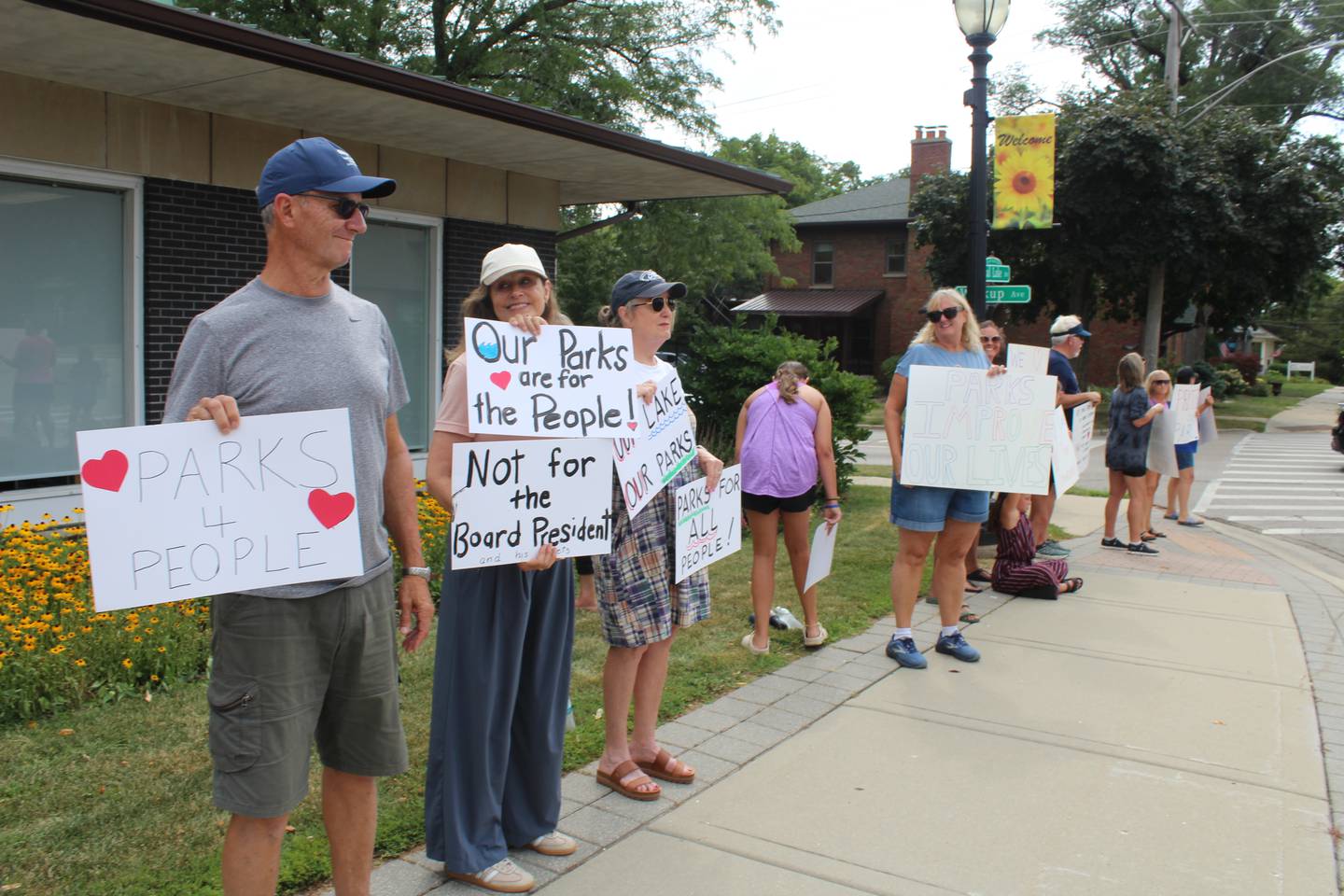 About 40 people rallied in support of the Crystal Lake Park District – and against recent actions by the park board – at a rally on Aug. 12, 2025, in front of park district headquarters.