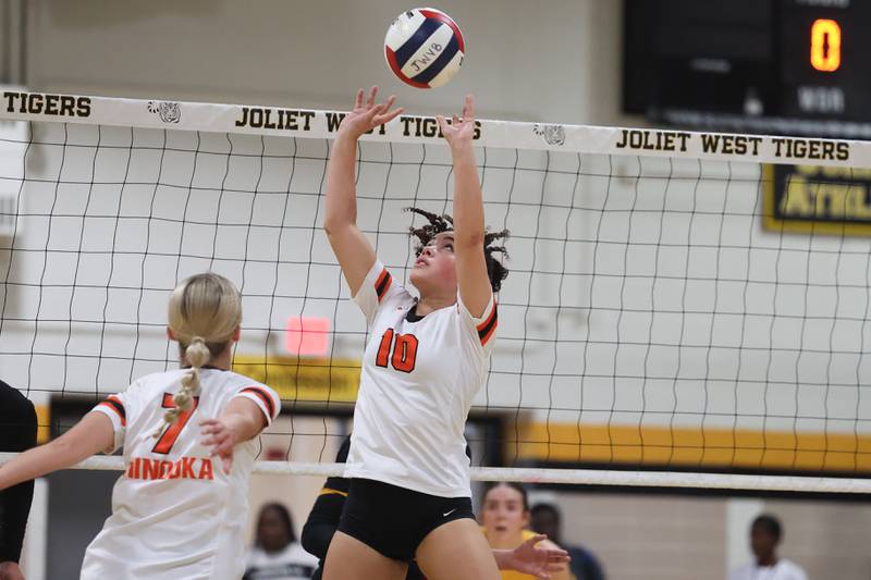 Minooka’s Ava Valentin sets the ball against Joliet West on Tuesday, Sept. 26, 2023 in Joliet.