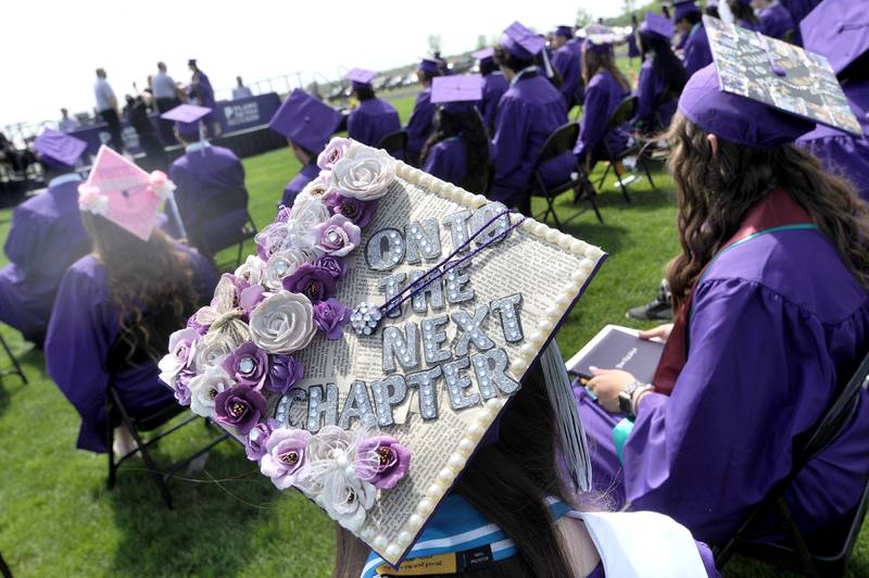 A graduate's mortarboard says it all during Plano High School's graduation ceremony on the football field, Sunday, May 19, 2024.