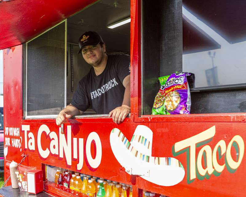 Jaime Barbosa serves from his food truck at the Joliet Police Department's National Night Out event Tuesday, Aug 5, 2025  in Joliet.