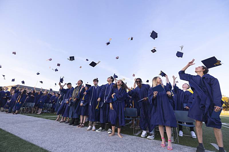 The Sterling High School class of 2023 fires their hats in the air following their commencement Friday, May 26, 2023.