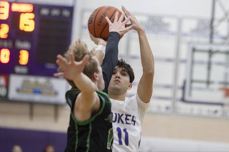 Dixon’s Wyatt Wetzell puts up a shot against Rock Falls Tuesday, Feb. 7, 2023.