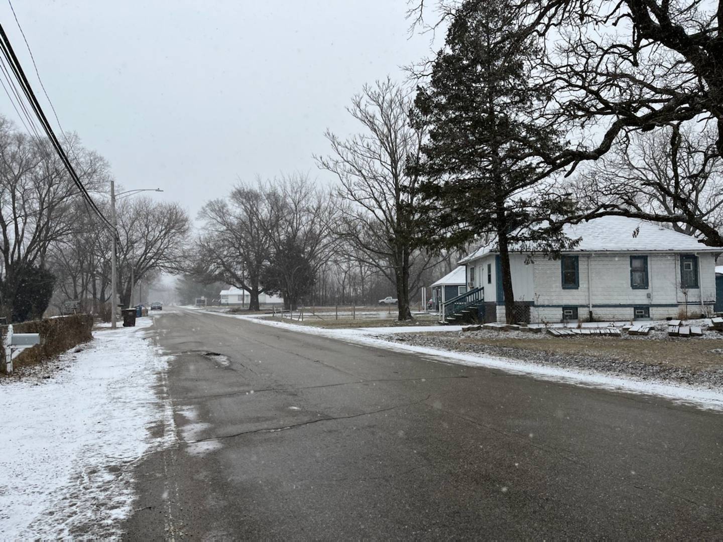 The eastern view of the 700 block of Patterson Road in Joliet Township seen on Thursday, Feb. 24, 2022. Will County Sheriff’s Office is investigating human remains found on Wednesday, Feb. 23, 2022 in a wooded area north of the roadway.