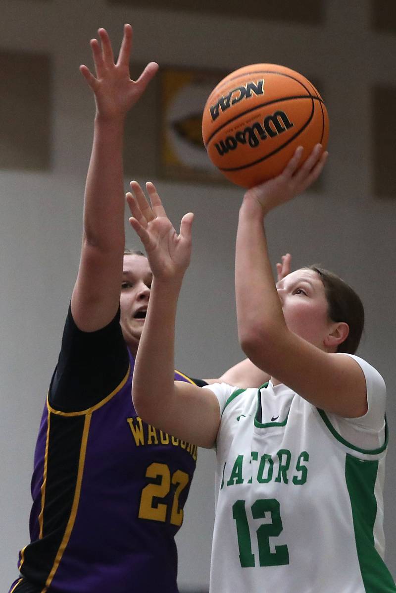 Crystal Lake South's Gaby Dzik shoots the ball in front of Wauconda's Kelsey Piehl during the Northern Illinois Holiday Classic Championship girl basketball game on Thursday, Dec. 18, 2025, at McHenry High School.