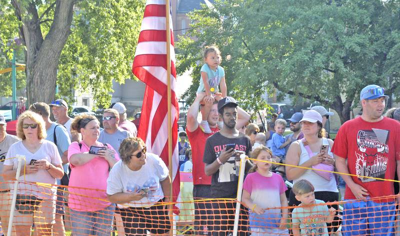 Fans watch runners cross the finish line at the Reagan Run 5K on Saturday, July 5, 2025 in Dixon.