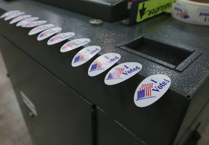 Voting stickers lay on a ballot machine at the Knights of Columbus Hall during the Primary Election on Tuesday, June 28, 2022 in Ottawa.