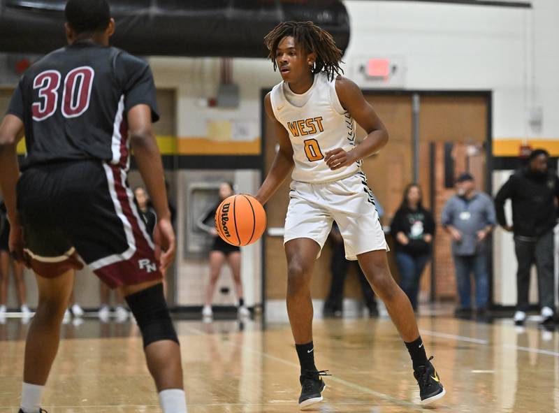 Joliet West's Aamir Shannon (0) in action during a conference game against Plainfield North on Friday, Dec. 20, 2024, at Joliet.