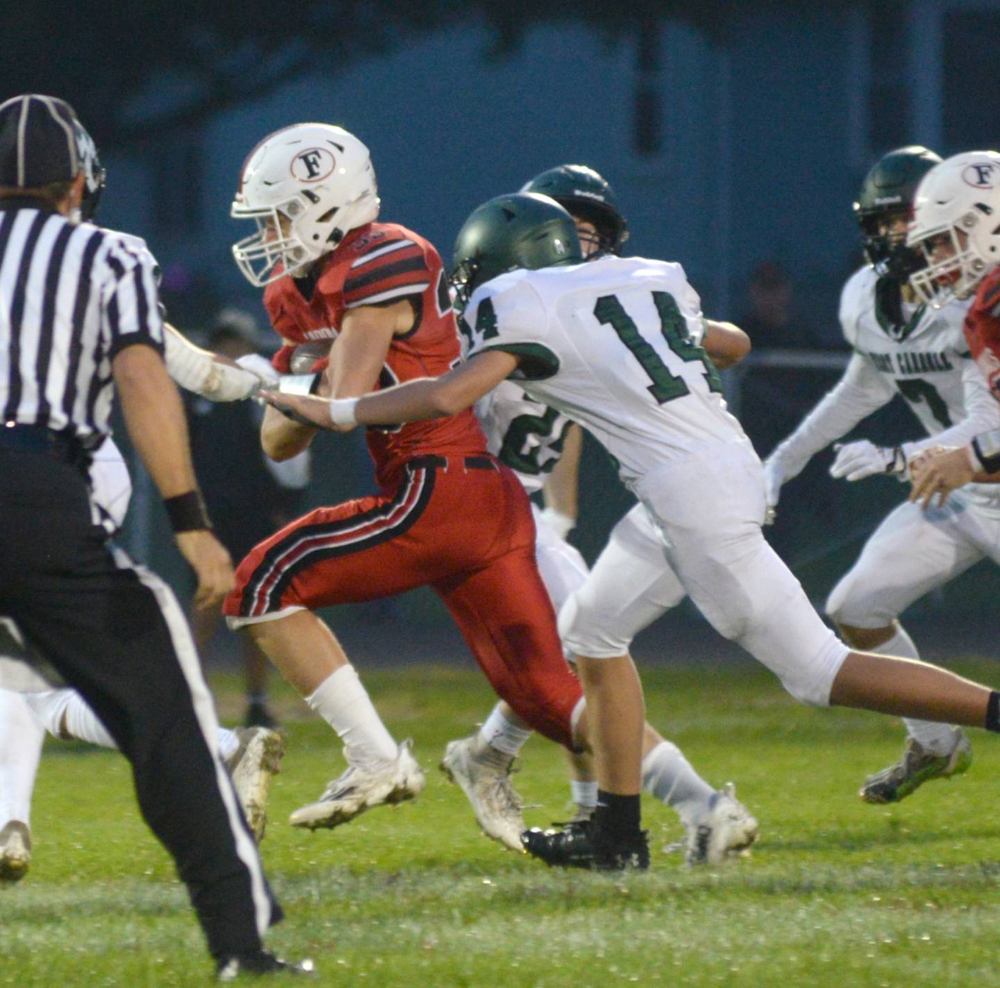 Forreston's Owen Mulder runs for a big gain as West Carroll's Aiden Buchhollz gives chase during Friday, Sept. 22, 2023 action at Forreston High School.