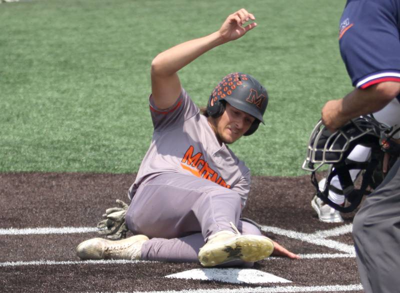 McHenry’s Donovan Christman slides safely into jhome against Barrington in IHSA Class 4A Sectional Title Game baseball action at McHenry High School in McHenry on Saturday, June 7, 2025.