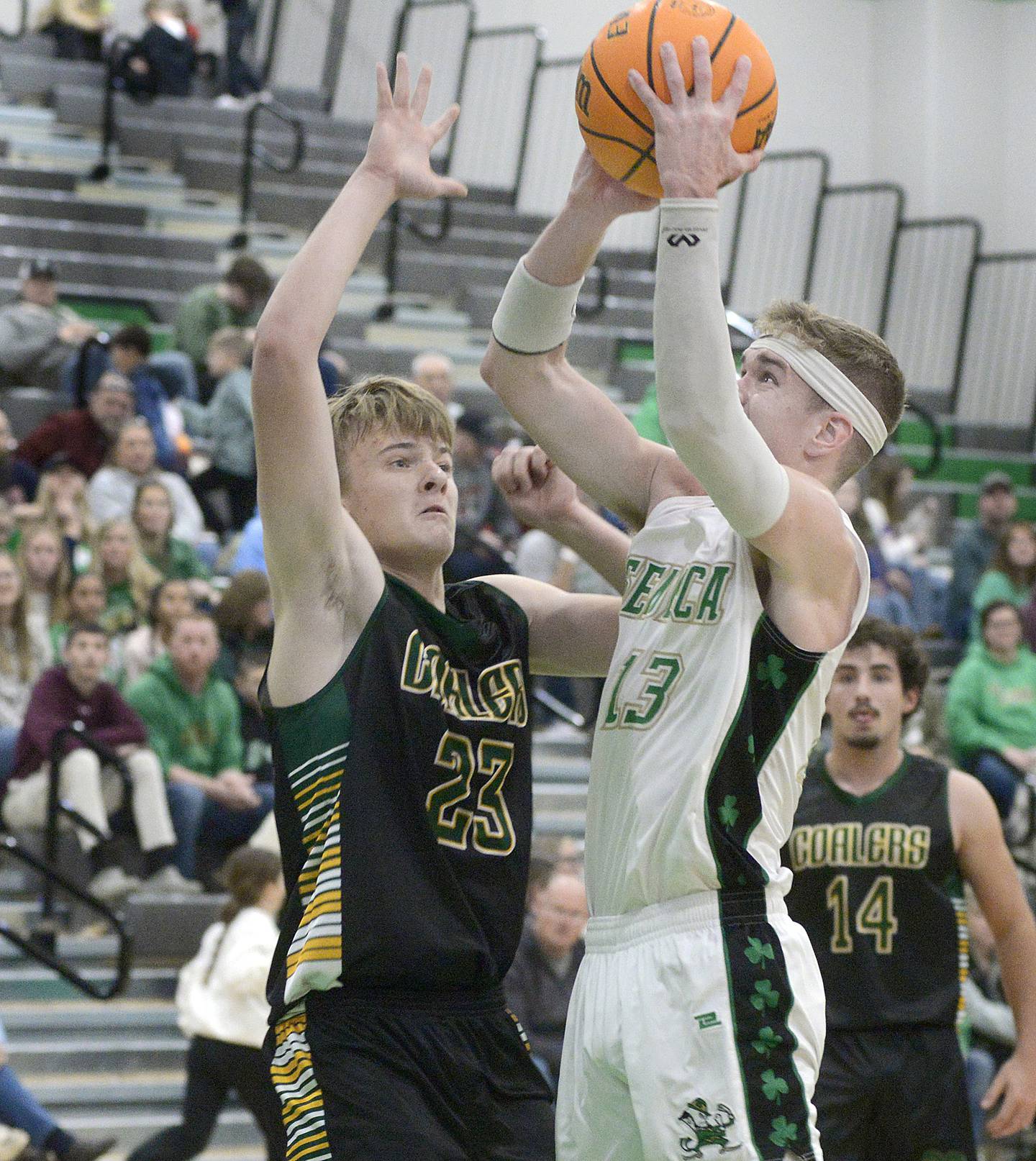 Seneca’s Paxton Giertz sets to get a shot over the block of Coal City’s Dylan Young in a game at the Shipyard Showdown Tournament last year at Seneca High School.