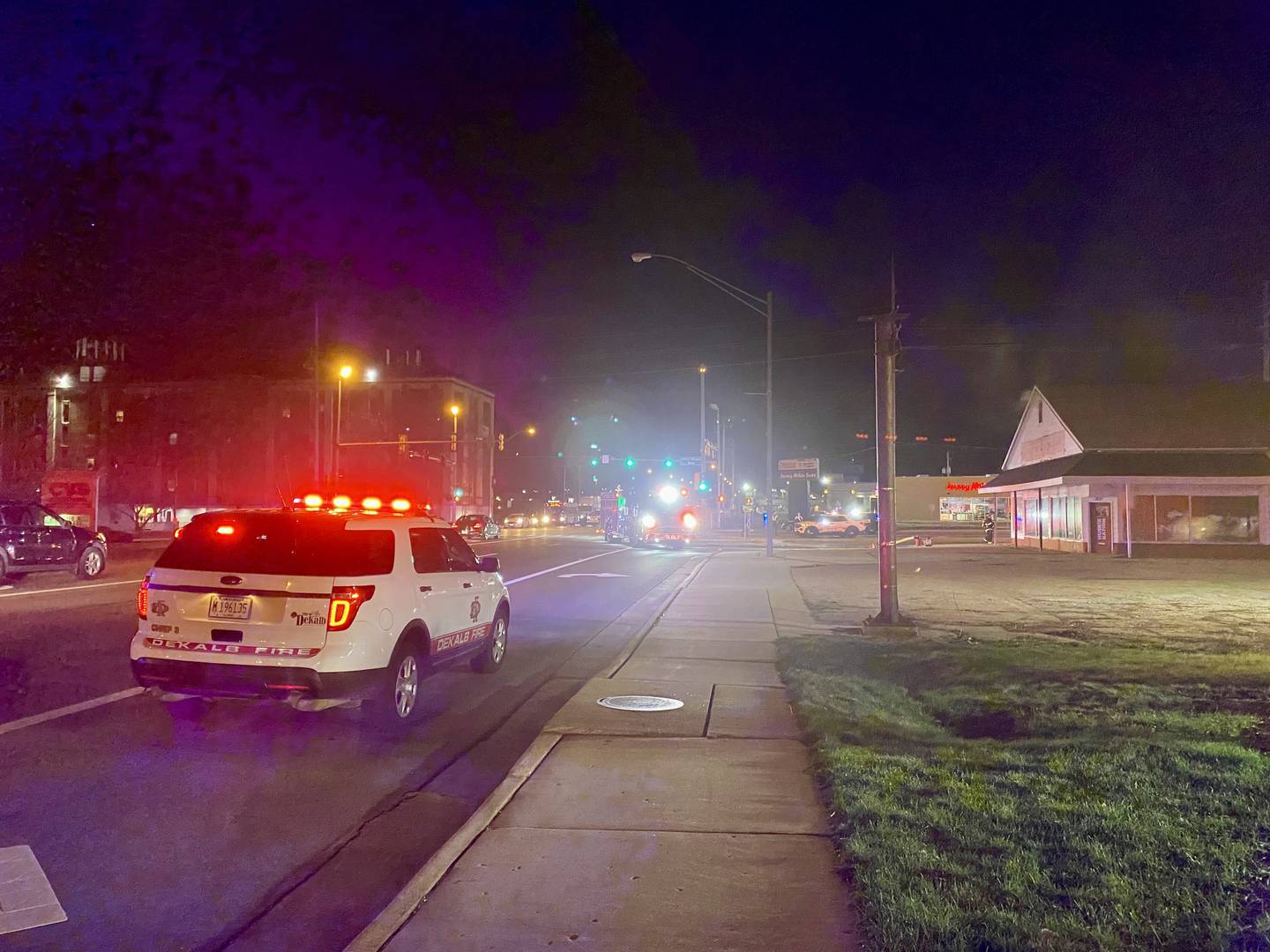 Crews from the DeKalb Fire Department respond to a structure fire around 11 p.m. Tuesday, March 19, 2024, at the now vacant building that once held Illini Tire Co., which closed in 2018. The intersection of West Lincoln Highway and Annie Glidden Road was closed as crews responded.