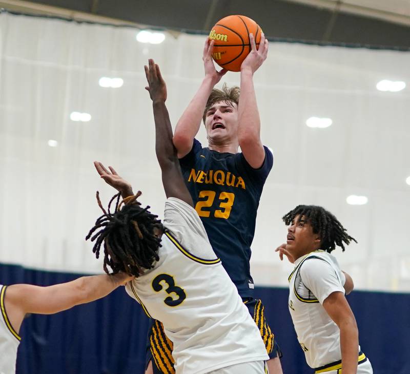 Neuqua Valley's Cole Kelly (23) shoots the ball in the post over Yorkville Christian's Jayden Riley (3) during a basketball game at Yorkville Christian High School on Tuesday, February 4, 2025.