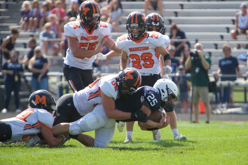 McHenry's Max Smits tackles Cary-Grove's Colin Desmet on Saturday, Sept. 17,2022 in Cary.