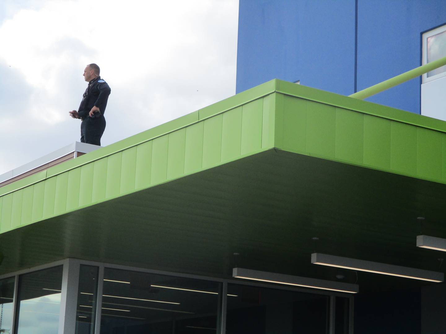 A Plainfield police officer on a roof at the Plainfield Park District Prairie Activity & Recreation Center was an example at the heavy police presence at the village's first Pride Fest. Oct. 16, 2022.