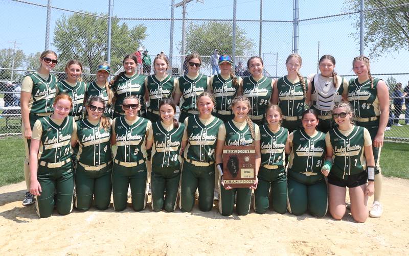 Members of the St. Bede softball team pose with the Class 1A Regional plaque after defeating Annawan/Wethersfield 12-0 in the Class 1A Regional final game on Saturday, May 20, 2023 in Annawan.
