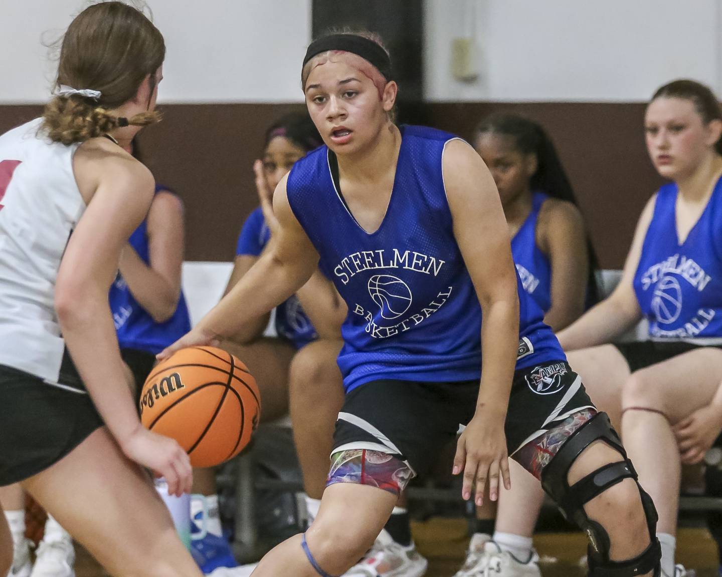 Joliet Central's Ellie Fowler handles the ball in their Morris Shootout girls basketball game.  June 18, 2025 in Morris.